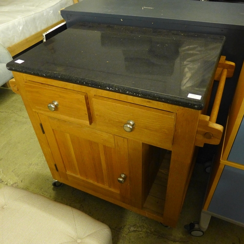 1594 - An oak and granite kitchen island unit