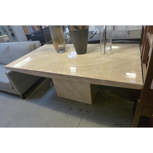 1616 - A cream marble effect dining table