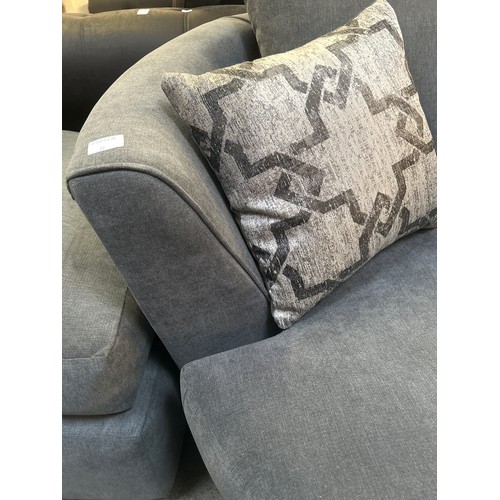 1501 - A mid grey upholstered swivel loveseat with patterned scatter cushions and foot stool