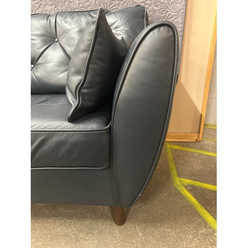 1490 - A Hoxton dark blue leather loveseat and footstool