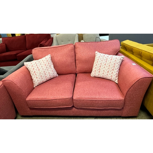 1527 - A Bubblegum textured weave scatter back three seater sofa (damaged)