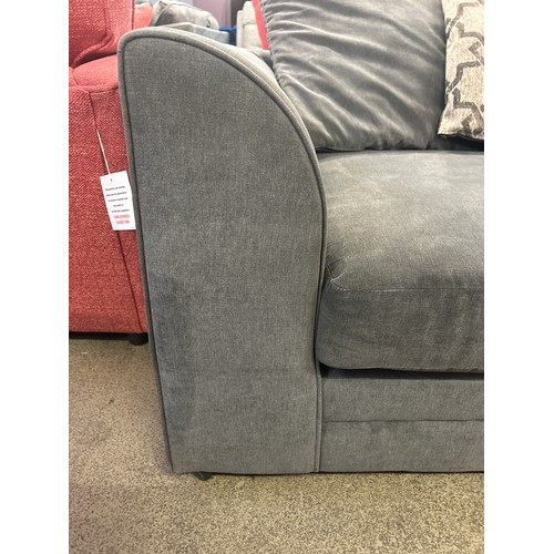 1537 - A mid grey three seater sofa with patterned scatter cushions, damaged