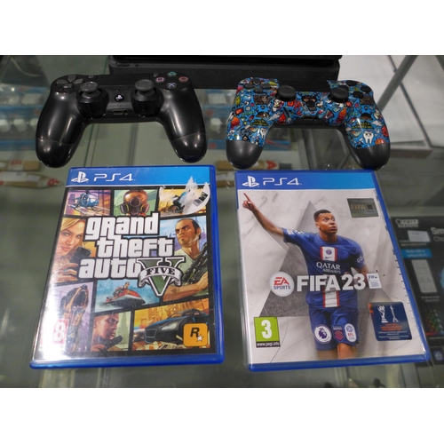 3232 - Playstation 4 Console with two controllers and two games with leads (GTA 5 and Fifa 23)