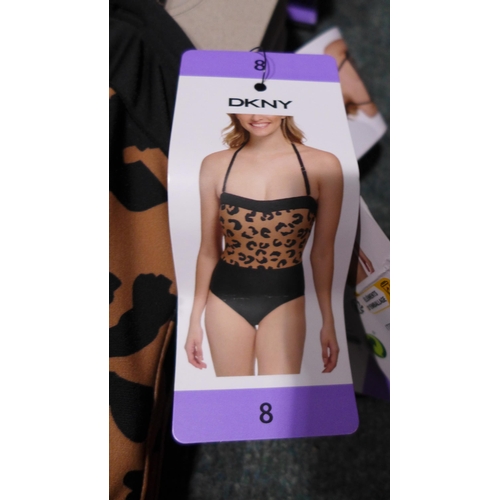 3313 - Five black and leopard print DKNY swimming costumes - size 8 * this lot is subject to VAT