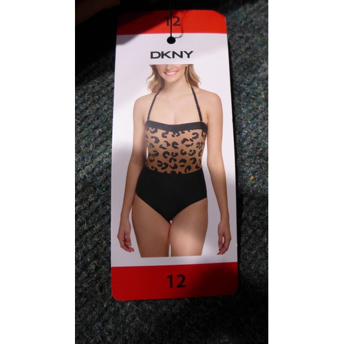 3319 - Five black and leopard print DKNY swimming costumes size 12 * this lot is subject to VAT