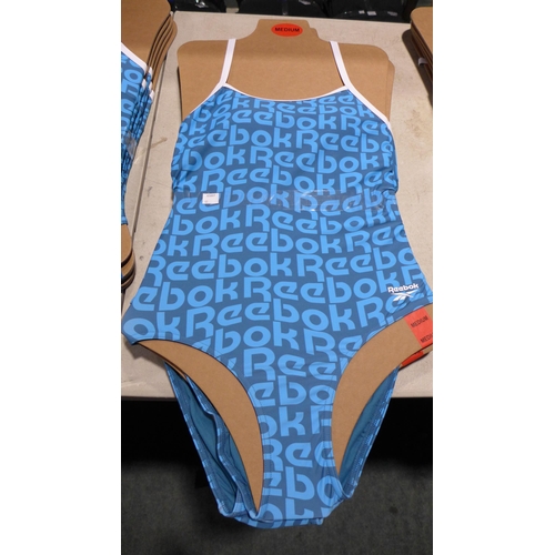 3328 - Five blue Reebok swimming costumes - size M * this lot is subject to VAT