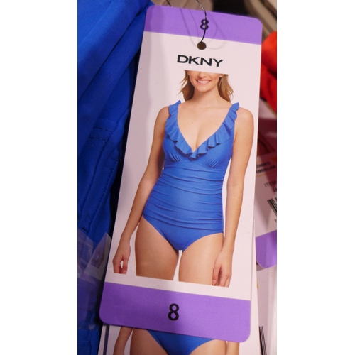 3345 - Six blue DKNY swimming costumes - size 8 * this lot is subject to VAT