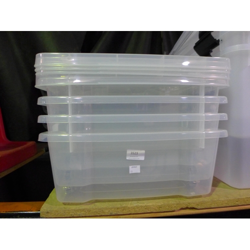 3523 - Four plastic under bed storage boxes on wheels