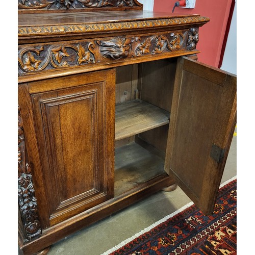 70 - A 19th Century French carved oak two door cupboard