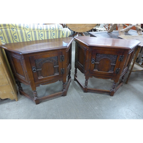 595 - A pair of Old Charm carved oak credence cupboards