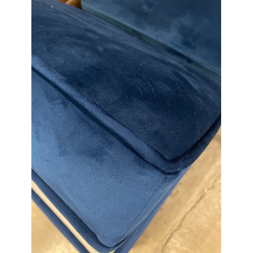 1322 - A pair of Hoxton blue velvet upholstered ottoman footstools