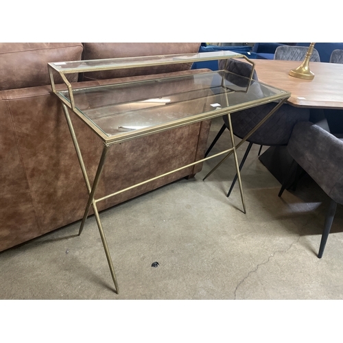 1325 - A gold coloured metal and glass desk