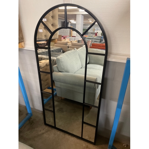 1341 - A large black arched mirror