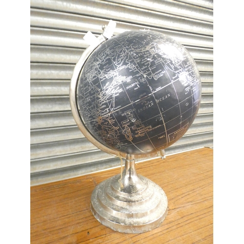 2273 - A navy blue and silver rotating globe