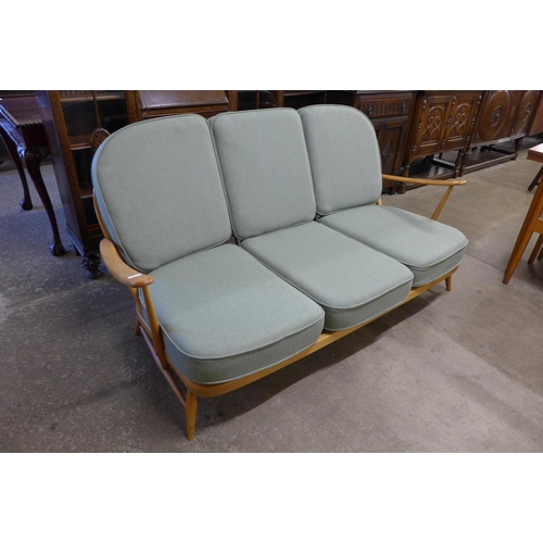 7 - An Ercol Blonde beech Windsor settee