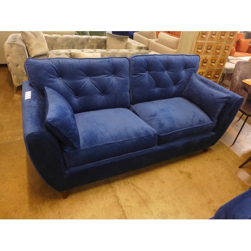 1320 - A Hoxton blue velvet three seater sofa RRP £799