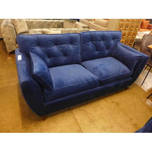 1321 - A Hoxton blue velvet three seater sofa RRP £799