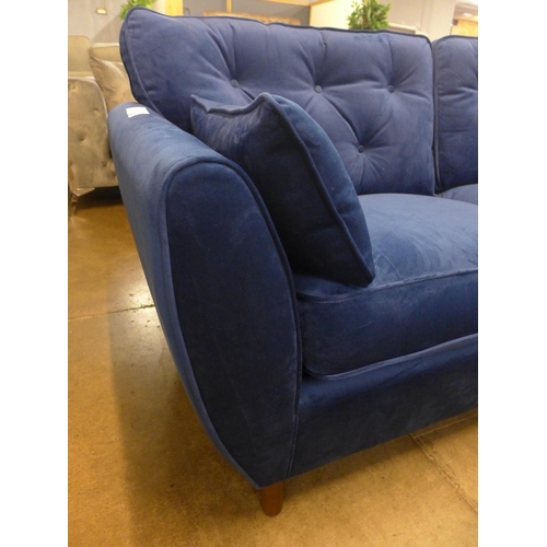 1321 - A Hoxton blue velvet three seater sofa RRP £799