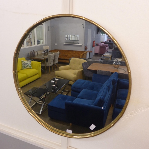 1373 - A circular gold painted bamboo effect mirror