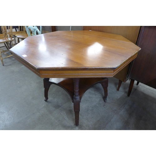 122 - A Victorian Aesthetic Movement walnut octagonal centre table