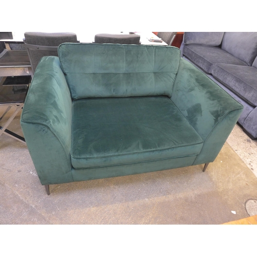 1439 - A deep green velvet upholstered love seat on chrome stiletto legs