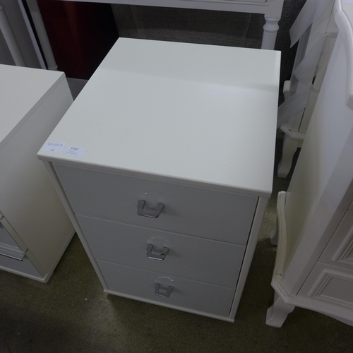 1569 - A white glass fronted three drawer bedside chest * this lot is subject to VAT