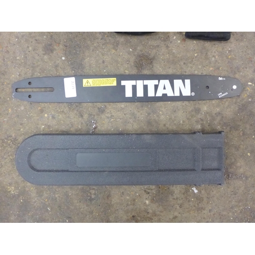 2239 - A Titan TTL758CHN chainsaw, an unused bar and protective gear