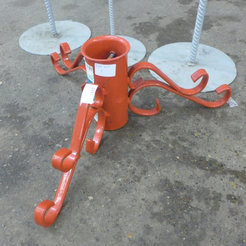 2242 - A red, metal Christmas tree stand