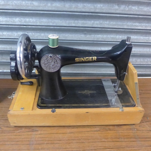 2296 - A vintage Singer sewing machine and carry case