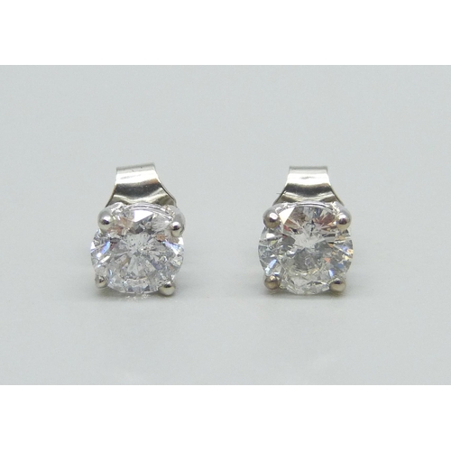 1003 - A pair of hallmarked platinum and diamond stud earrings, total diamond weight 1.78ct