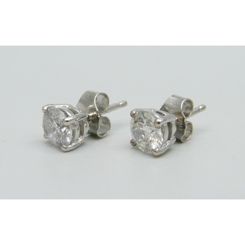 1003 - A pair of hallmarked platinum and diamond stud earrings, total diamond weight 1.78ct