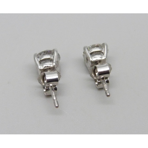 1003 - A pair of hallmarked platinum and diamond stud earrings, total diamond weight 1.78ct