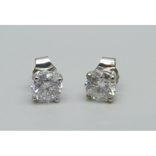 1003 - A pair of hallmarked platinum and diamond stud earrings, total diamond weight 1.78ct