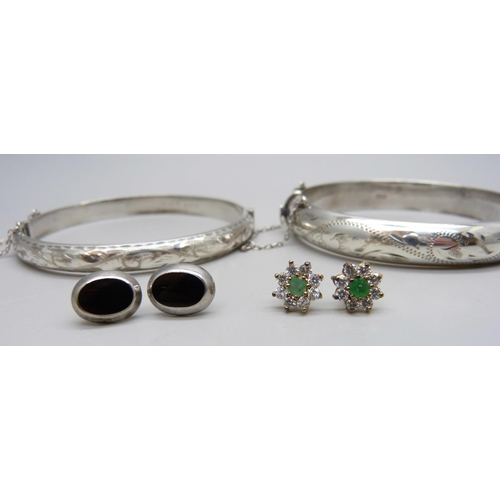 1009 - Two silver bangles, a pair of silver earrings and a pair of unmarked cluster earrings