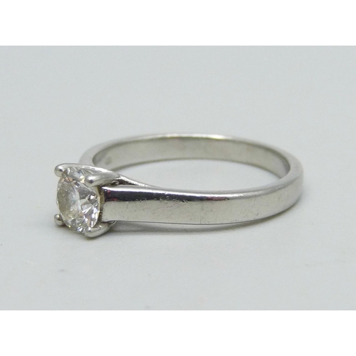 1011 - A platinum ring set with a diamond, 3.8g, K, approximately 0.5ct diamond weight