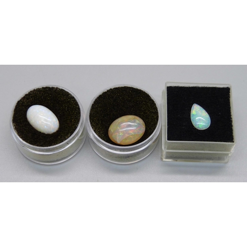 1015 - Three unmounted opals, 2.6g