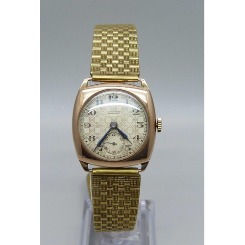 1026 - A 9ct gold cased wristwatch, dial signed Dominant, 27mm case