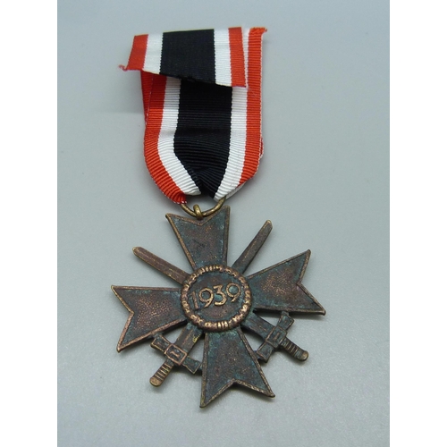 1028 - A German WWII Merit Cross medal with swords