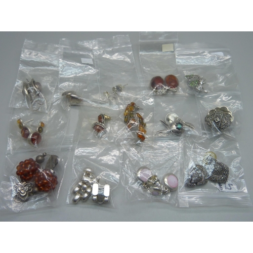 1038B - A collection of fourteen pairs of silver earrings