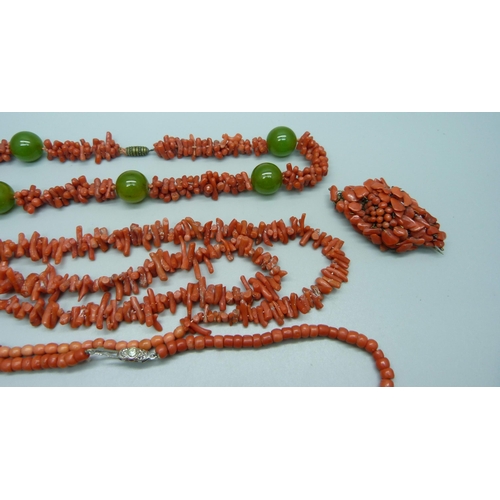 1047 - Five coral necklaces and a brooch