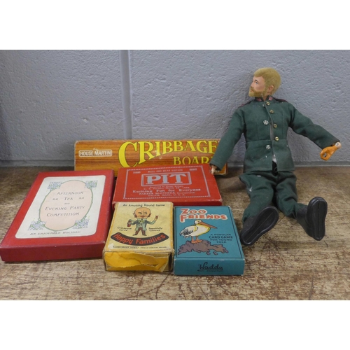 1064 - A collection of vintage toys and games, a globe, an Action Man, lacking hand, and marbles **PLEASE N... 