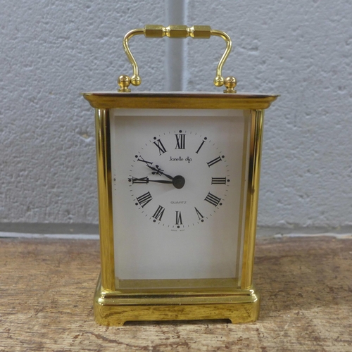 1067 - A brass cased carriage clock, quartz movement