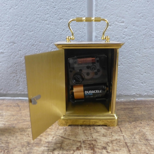 1067 - A brass cased carriage clock, quartz movement