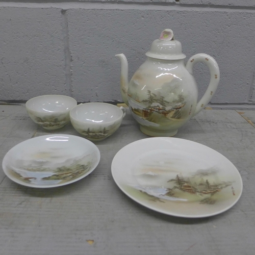 1102 - A Japanese tea and dinner service **PLEASE NOTE THIS LOT IS NOT ELIGIBLE FOR POSTING AND PACKING**