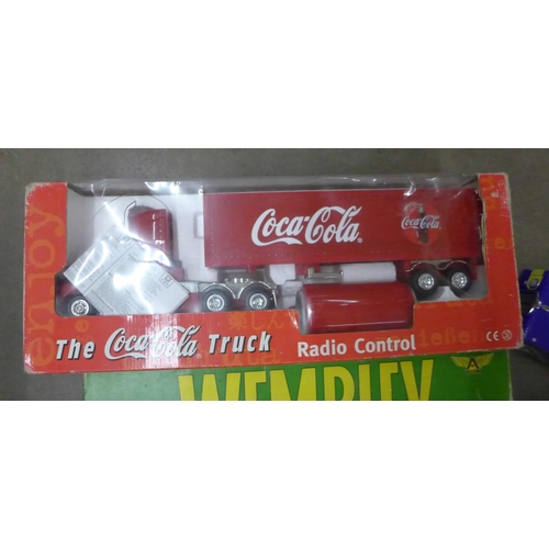 1108 - A Wembley board game, a Coca-Cola truck, an England car pack, a Maisto 1/18th scale model of a Jagua... 