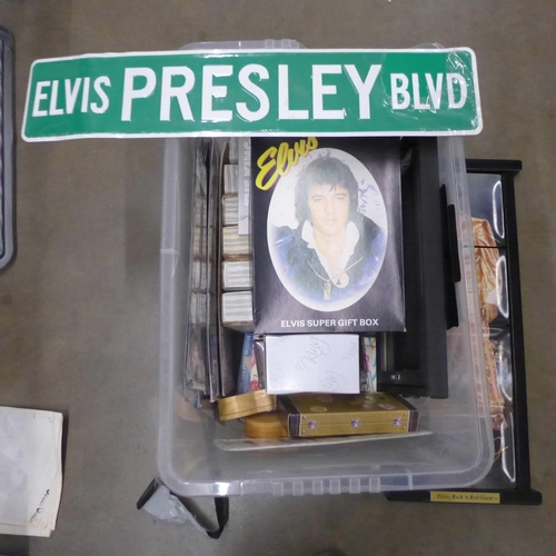 1109 - A box of Elvis Presley memorabilia, including a four-tiled picture, books, plates, number plate and ... 