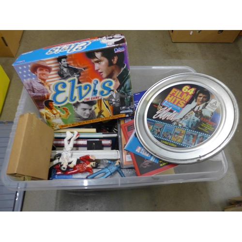 1116 - A box of Elvis Presley memorabilia, books, encyclopedia, watches in gift presentation packs, an Elvi... 