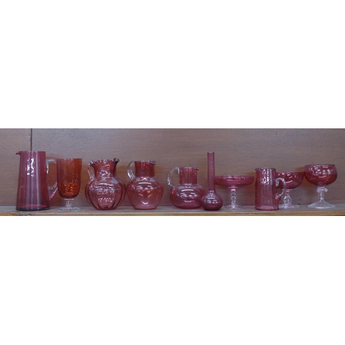 609 - A collection of cranberry glass jugs, pitcher, bonbon dishes, etc. (10) **PLEASE NOTE THIS LOT IS NO... 