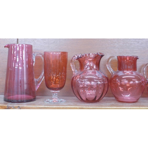 609 - A collection of cranberry glass jugs, pitcher, bonbon dishes, etc. (10) **PLEASE NOTE THIS LOT IS NO... 