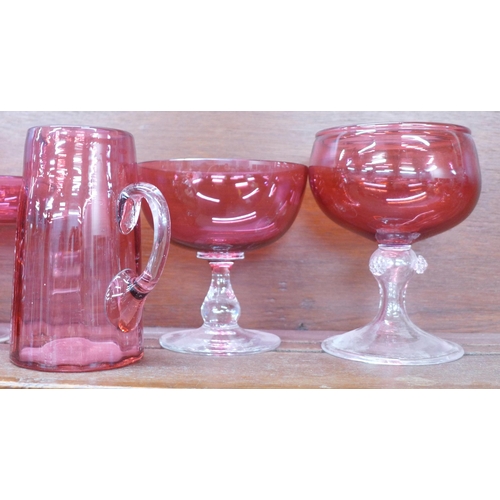 609 - A collection of cranberry glass jugs, pitcher, bonbon dishes, etc. (10) **PLEASE NOTE THIS LOT IS NO... 